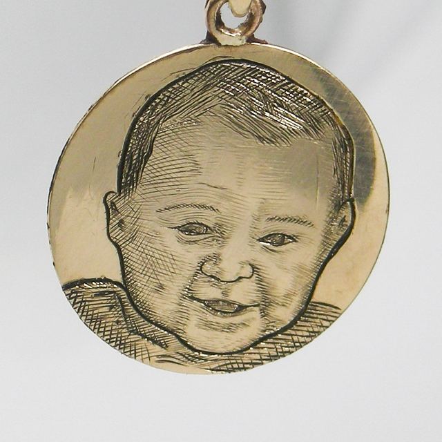 Gold pendant with a hand-engraved portrait