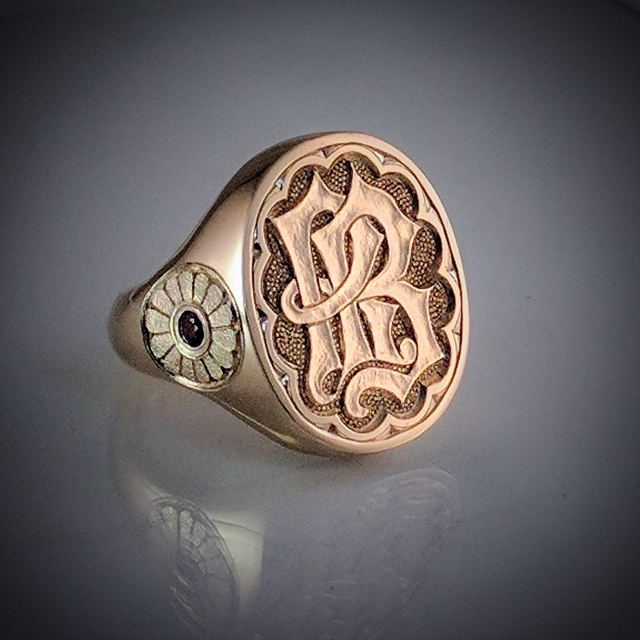 Gold signet ring with a hand-engraved script monogram