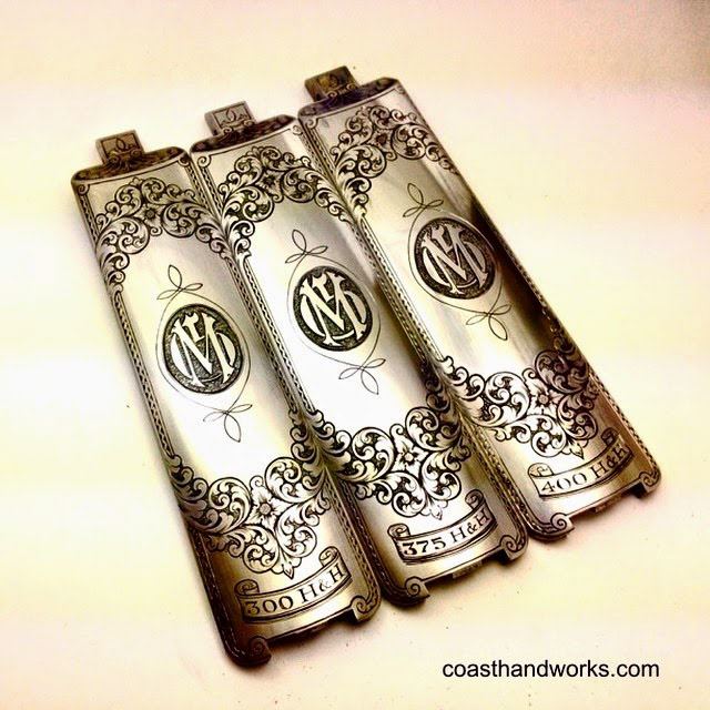 Pistol grip frame, hand-engraved with dense floral scrollwork