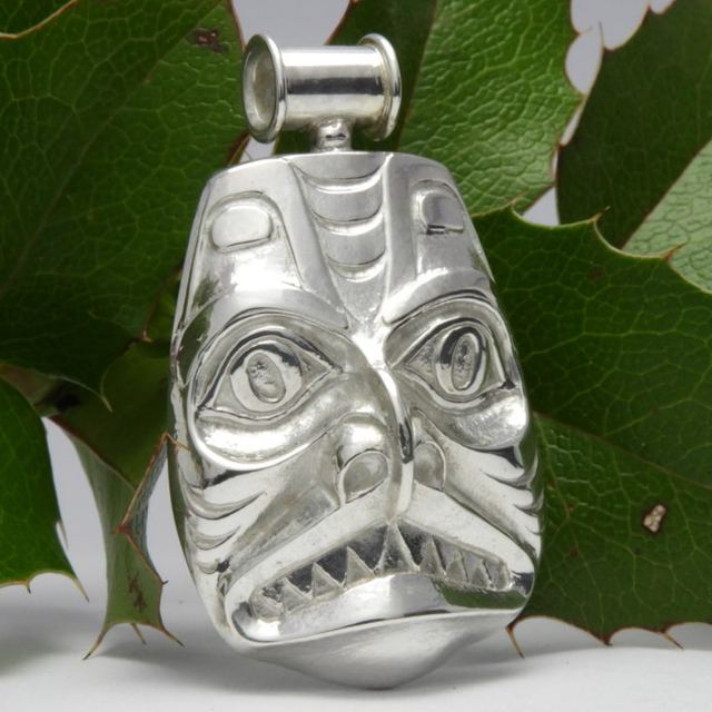 Carved silver pendant in Haida style