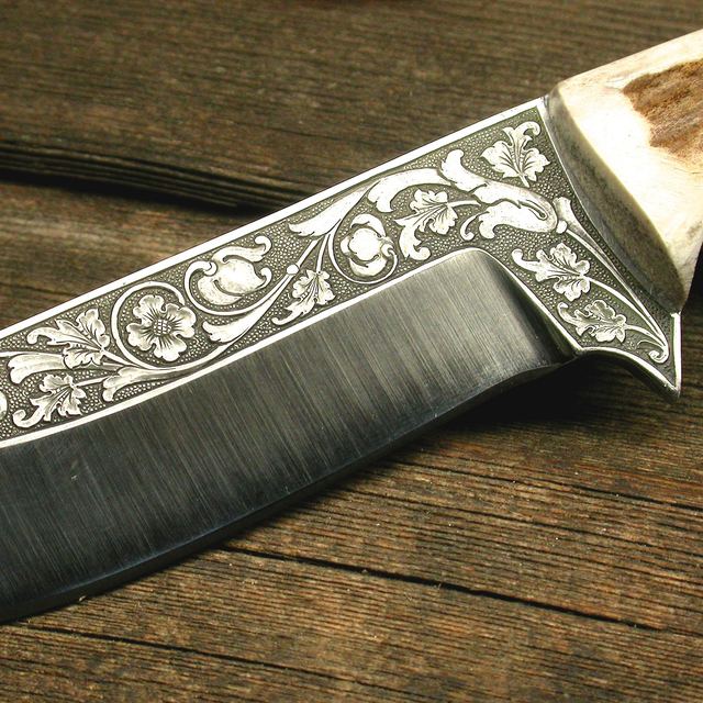 Custom knife blade with hand-engraved scrollwork